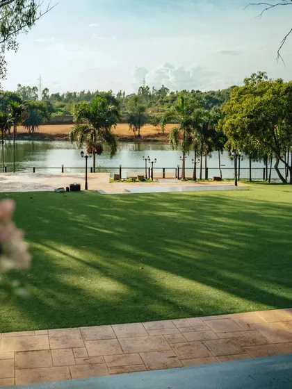 A view of our expansive lawn by the lake, perfect for events, games, or just relaxing in the sun.