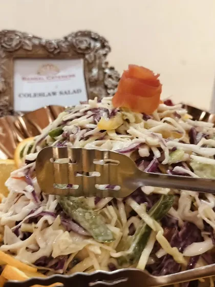 My classic coleslaw salad, made with fresh cabbage and carrots in a creamy dressing, served in an ornate bowl.