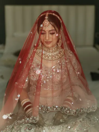 The moment before. The bride, veiled and ready, in a moment of quiet contemplation. The soft, dreamy quality of this photo captures the anticipation and the glow of forever in her eyes.