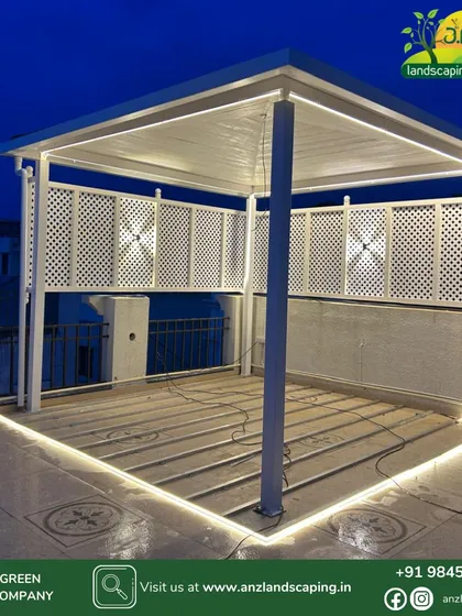 Night-time ambiance is key to a great terrace. Here, we installed a custom white gazebo with integrated LED strip lighting along the floor and elegant lattice panels, creating a bright and inviting space for evening gatherings.