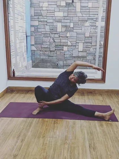 "It doesn't matter what your strength or limitations are, you just have to show up." A beautiful Parivrtta Janu Sirsasana (revolved head-to-knee pose).