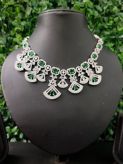 The full view of the emerald-green AD set, showing the necklace and matching earrings.
