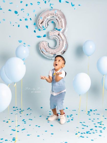 The pure, uncontainable joy of a three-year-old. This confetti shot perfectly captures the energy and excitement of a birthday.