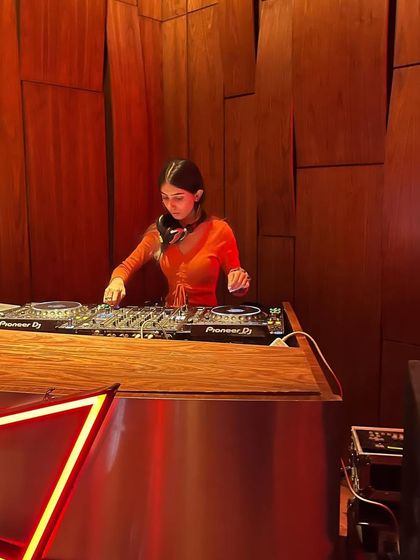 Playing a techno set in the warm, ambient lighting of the venue. The mood was perfect for this style of music.