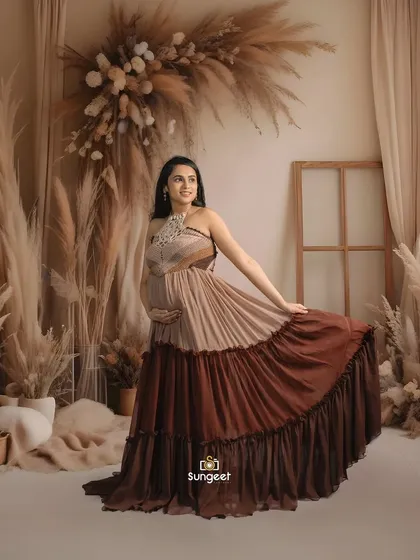 A playful, twirling pose to show the movement and flow of this beautiful tiered maternity dress.