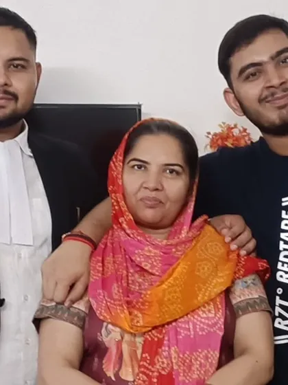 With my mother and brother. Their belief in me fuels my determination to succeed for my clients.