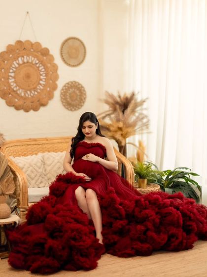 A full view of this magnificent ruffled red gown, showcasing its dramatic texture and volume in our boho studio.