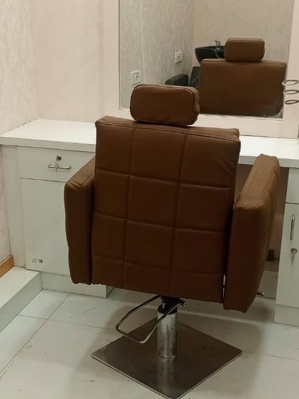 This is one of my styling stations, complete with a comfortable, adjustable chair and a large mirror. This is where the final transformation and haircut take place.