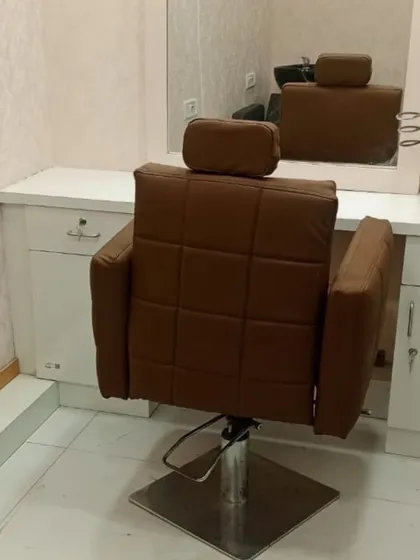This is one of my styling stations, complete with a comfortable, adjustable chair and a large mirror. This is where the final transformation and haircut take place.