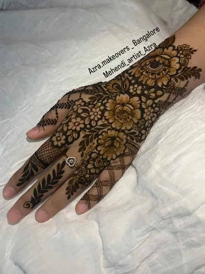 This is a classic Arabic mehendi design. I love creating these bold floral and vine patterns that look elegant and stand out.