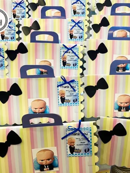 A close-up of the Boss Baby party favors. Each bag is personalized with a thank you tag, adding a special touch to your child's birthday celebration.
