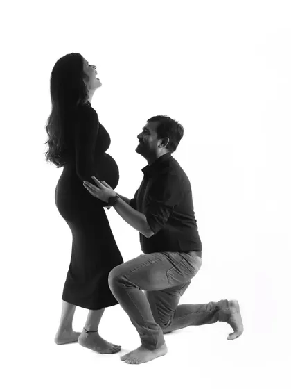 A moment of pure laughter and joy, captured in a timeless black and white silhouette. This shows that even artistic shots can be full of fun and personality.