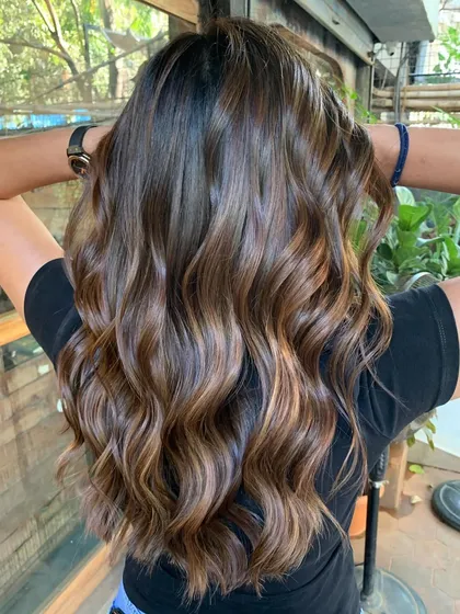 Sun-kissed and summer-bound. A gorgeous, natural-looking balayage that gives a warm glow to the hair, created without any bleach.