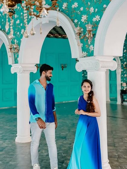 A relaxed moment between a couple. I styled them in coordinated blue ombre outfits that feel modern and effortless against the elegant interior.