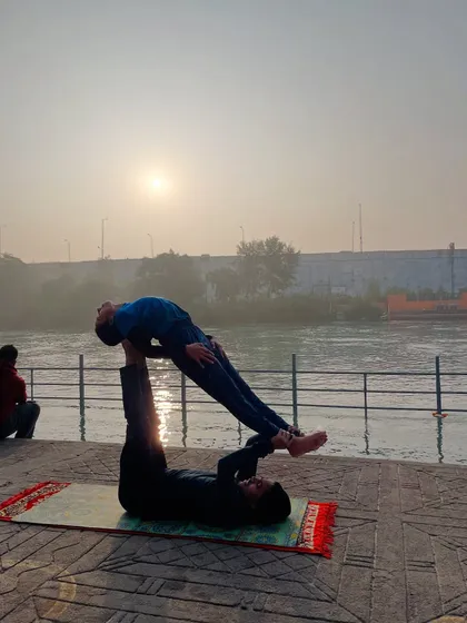Practicing acroyoga by the sacred Ganges river in Haridwar at sunrise. My teaching is grounded in these spiritual roots, bringing a sense of authenticity and deep calm to every session I lead.