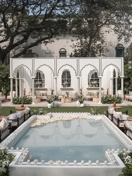 We designed this 'Oasis of Love' by fusing Mughal architecture with a contemporary garden setup, featuring a central reflecting pool for a tranquil and luxurious daytime wedding.