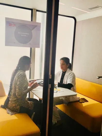Every health journey begins with a deep understanding of your unique needs. Here, I am in a one-on-one consultation, discussing lifestyle, health history, and goals to create a truly personalized nutrition plan that works for you, even with a busy corporate schedule.