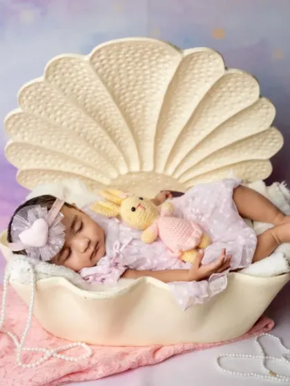 Our tiny mermaid is making waves already. Even our newborns can enjoy a touch of fantasy in their first photoshoot.