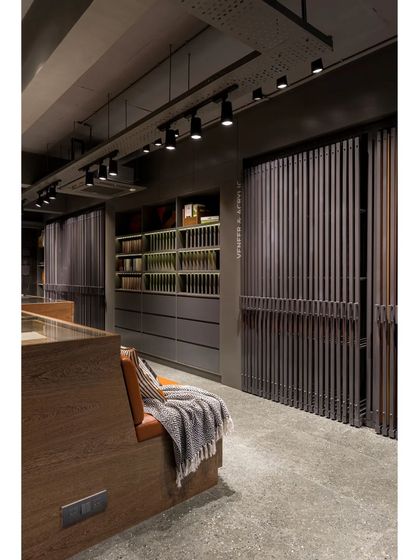 A comfortable seating area integrated into the showroom's layout, providing a space for informal client meetings.