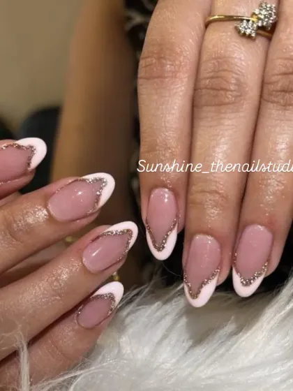 Another view of the white and silver glitter French design.