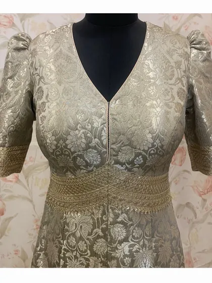 A full front view of the elegant Banarasi brocade jumpsuit, showcasing its unique fusion of traditional Indian textile with a western silhouette.