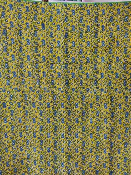 The floral backing fabric for the pinwheel quilt.