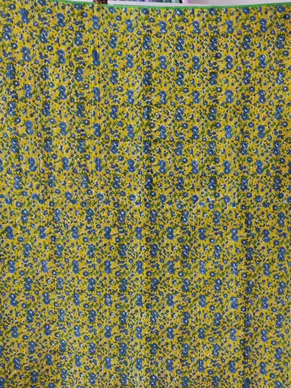 The floral backing fabric for the pinwheel quilt.