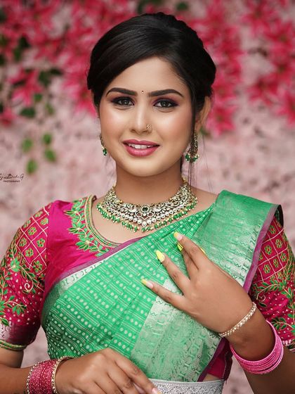 A look I demonstrated for my professional makeup artist course. This features a vibrant pink and green theme, with bold eyeshadow and a flawless base.