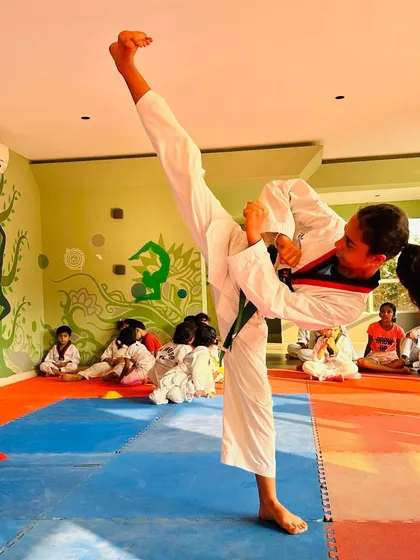 Another example of an excellent high kick, demonstrating the flexibility and strength we build in our students.