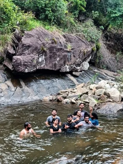 A small group enjoying a quiet moment in a natural pool during our Chikmagalur trip.