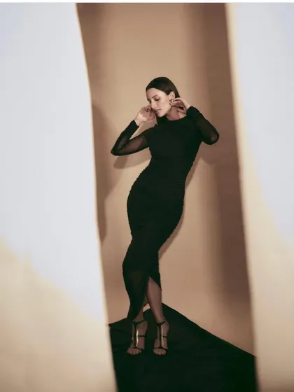 An all-black look is always a classic. I styled Tripti Dimri in this elegant ruched black dress with sheer sleeves, creating a sophisticated and versatile look suitable for many occasions.