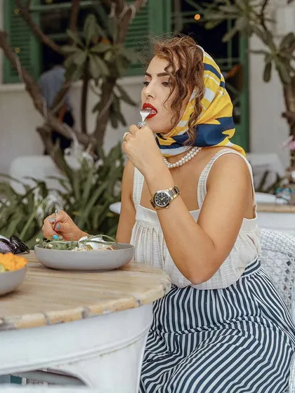 A candid dining moment captured at Olive Bistro. The side profile and the act of eating create an authentic, in-the-moment feel that tells a story.