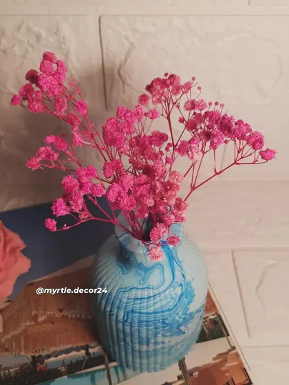 A closer shot of the flowers in our blue marbled vase. The ribbed texture of the vase adds another layer of visual interest.