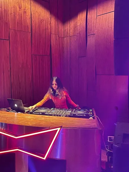 A wider shot of the DJ booth, showing how I command the space during a techno set.