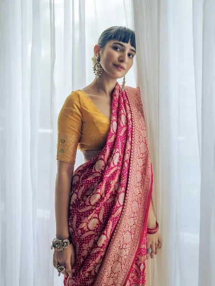 A testament to my love for Indian textiles. This is a stunning Kaduwa Banarasi saree with a Ganga Jamna weave and intricate bandhani work, a piece that took an entire year to handcraft.