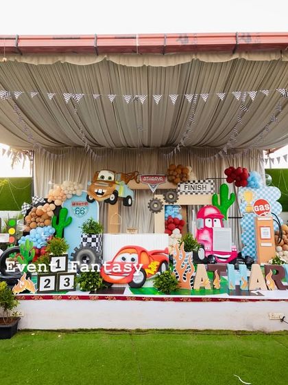 A wider view of the Disney Cars stage, showing the full setup under a tent, perfect for an outdoor party.