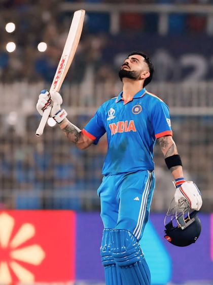 Virat Kohli looks to the heavens, a moment of reflection and gratitude on the cricket field. A powerful portrait of an icon.