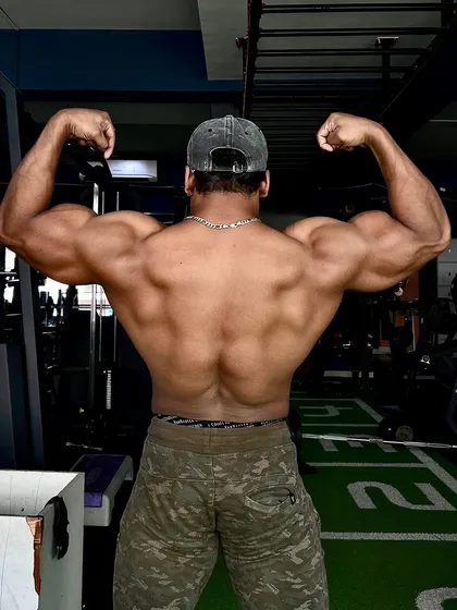 We focus on building well-rounded, aesthetic physiques. This is the result of disciplined training and nutrition, targeting back width and thickness for a powerful V-taper.