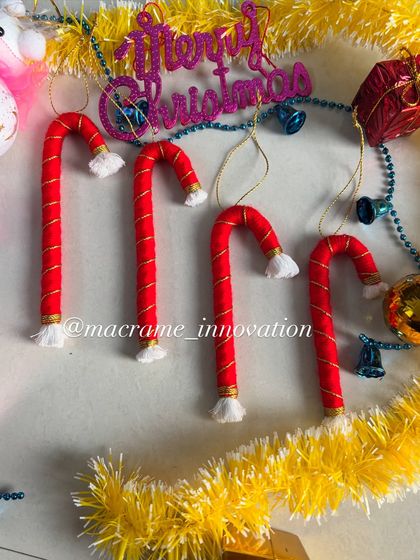 Classic candy cane ornaments, handmade with red and white cord. They look so sweet hanging on a Christmas tree.