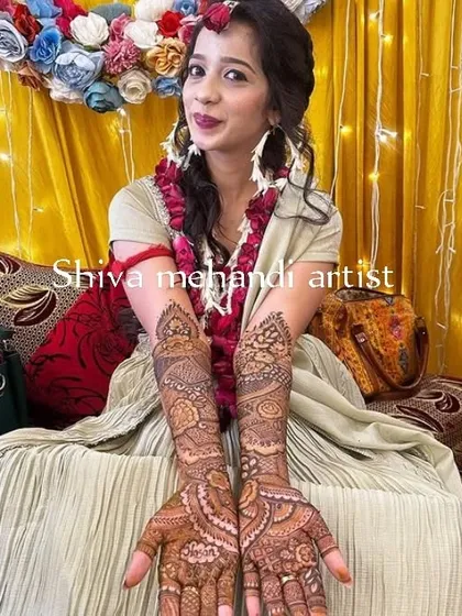 A lovely design with a focus on paisley and floral motifs, creating a soft and feminine look perfect for any celebration.