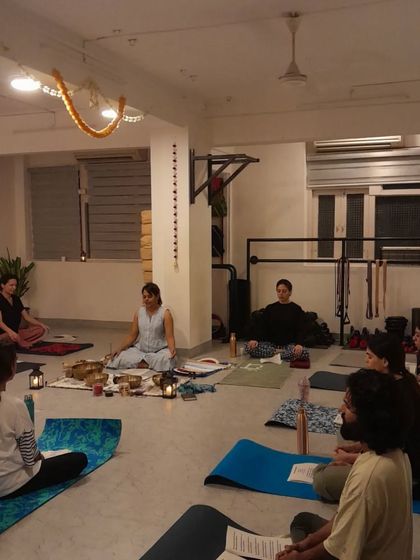 The serene atmosphere of our Kojagiri Purnima (full moon) sound bath, with the community gathered in a circle.