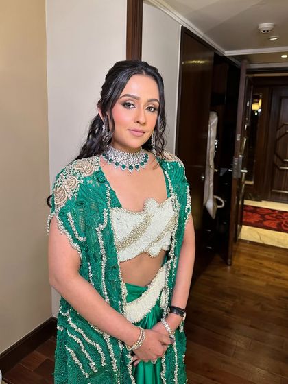 The client looking effortlessly cool and stylish in her Anamika Khanna outfit and bohemian hairstyle.