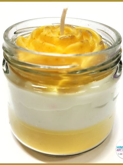 A layered wax candle in a jar, topped with a beautifully molded yellow rose. Learn to add sculptural elements to your candle designs.