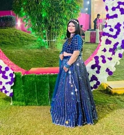 A full view of the sparkling navy blue rental lehenga. It’s a great choice for an outdoor evening event, where the sequins can truly shine.