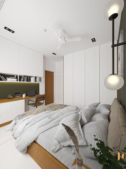 A perspective from the bed, looking towards the integrated study unit and the entrance.