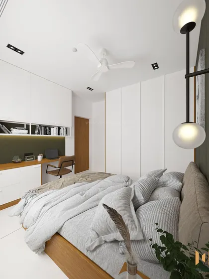 A perspective from the bed, looking towards the integrated study unit and the entrance.