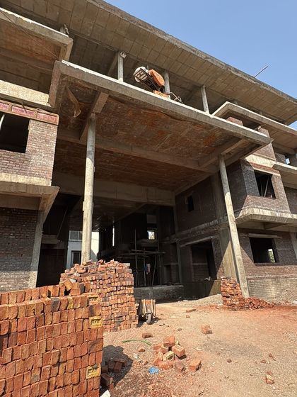 A similar view of the construction site, showing the large, open spaces that will eventually become grand living areas.