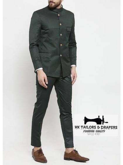 A full view of a dark green Jodhpuri suit, tailored for a sleek and modern profile. This style is perfect for receptions and formal gatherings.