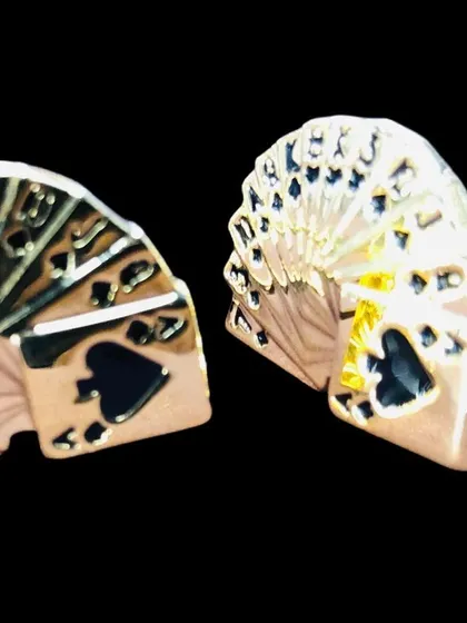 Perfect for card enthusiasts, these cufflinks are shaped like a fanned-out deck of playing cards. The gold-tone metal and black enamel detailing make them a playful yet stylish accessory.