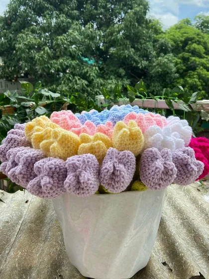 The rainbow tulip bouquet arranged in a vase.